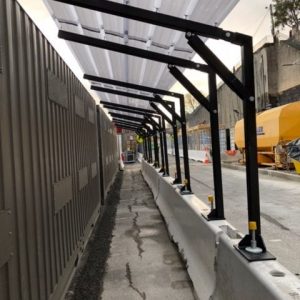 Walkway-cover-connecting-to-anchors-on-Jersey-Barriers-2-e1568344263123